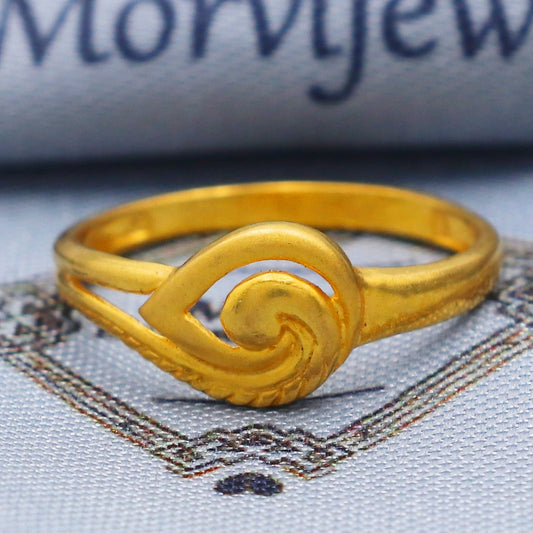 Gold ring with intricate design on a textured fabric background with 'Morvijewels' branding.